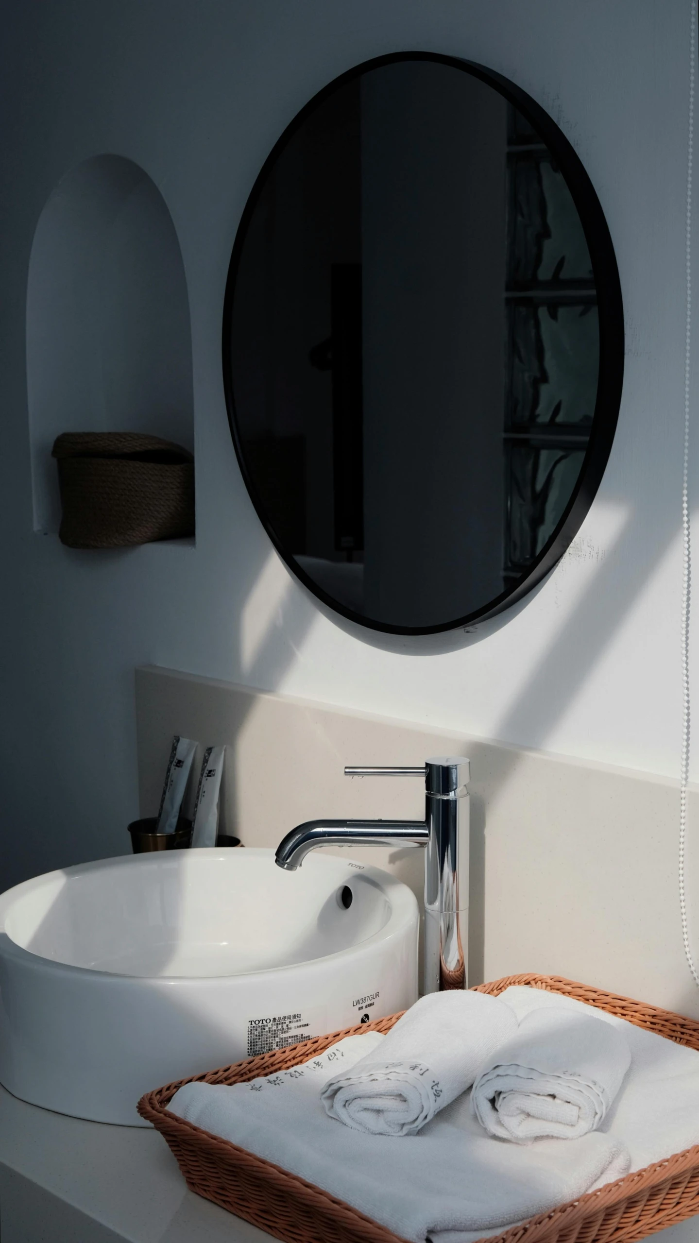 two towels sitting next to each other near a bathroom sink