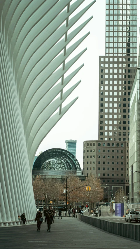 a walkway next to a bunch of tall buildings