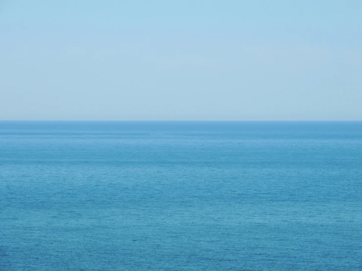 a person riding on the ocean in a boat