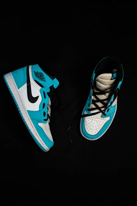 a pair of blue nike shoes