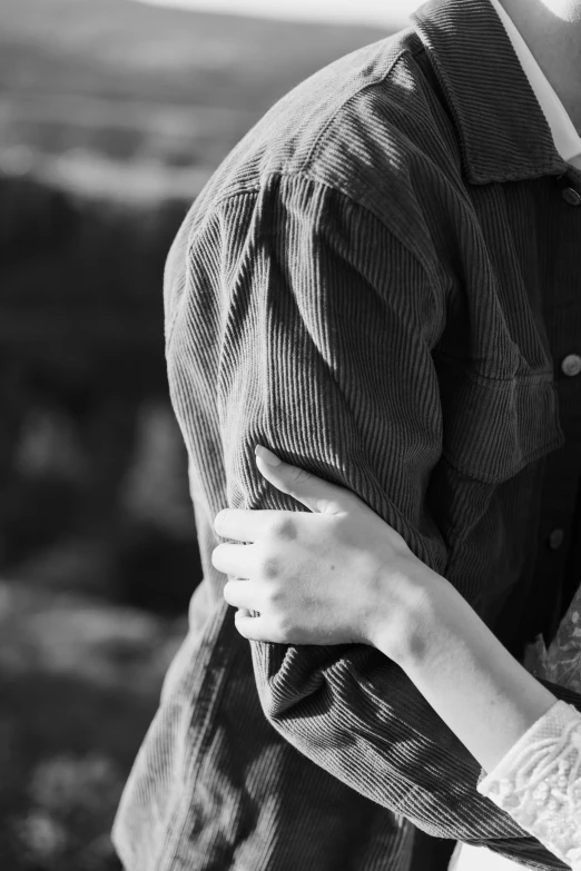 black and white pograph of two people emcing each other