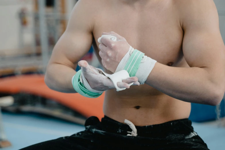 a shirtless male wearing a pair of bandages