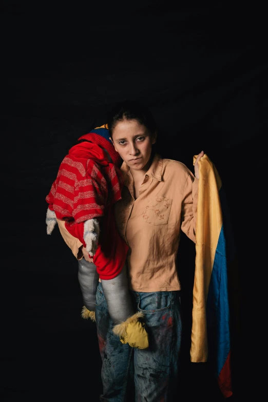 a woman holding onto a stuffed animal with a flag