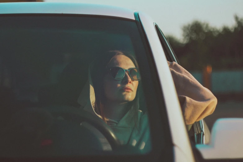 a person in a car on the phone