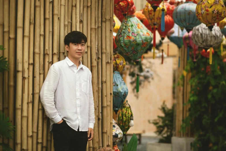 man and young child in front of wall decorations