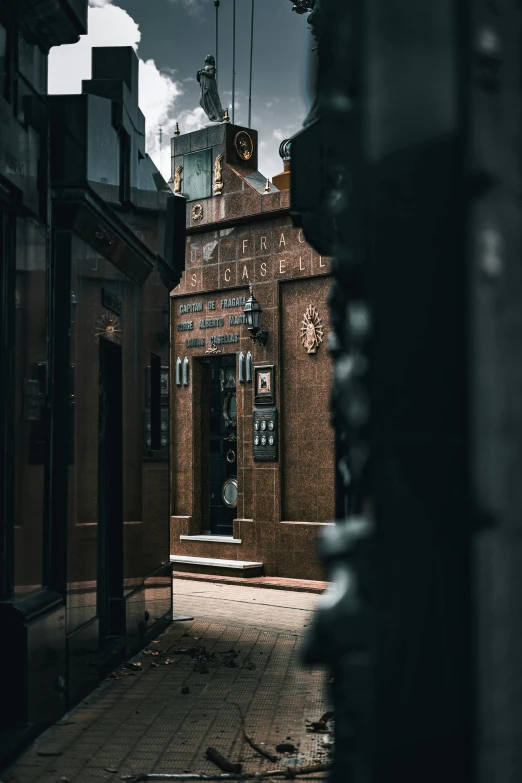 the entrance to an old brick building with an analog clock tower