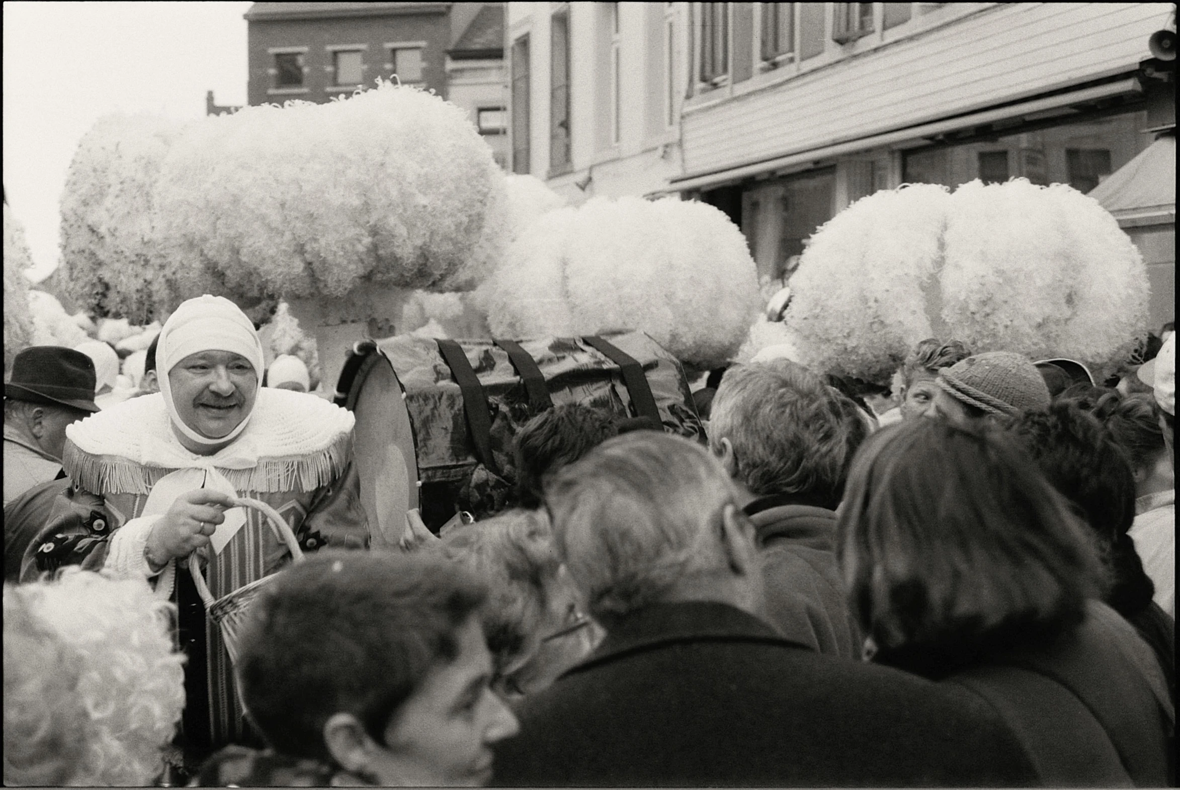 a black and white image of an old time parade