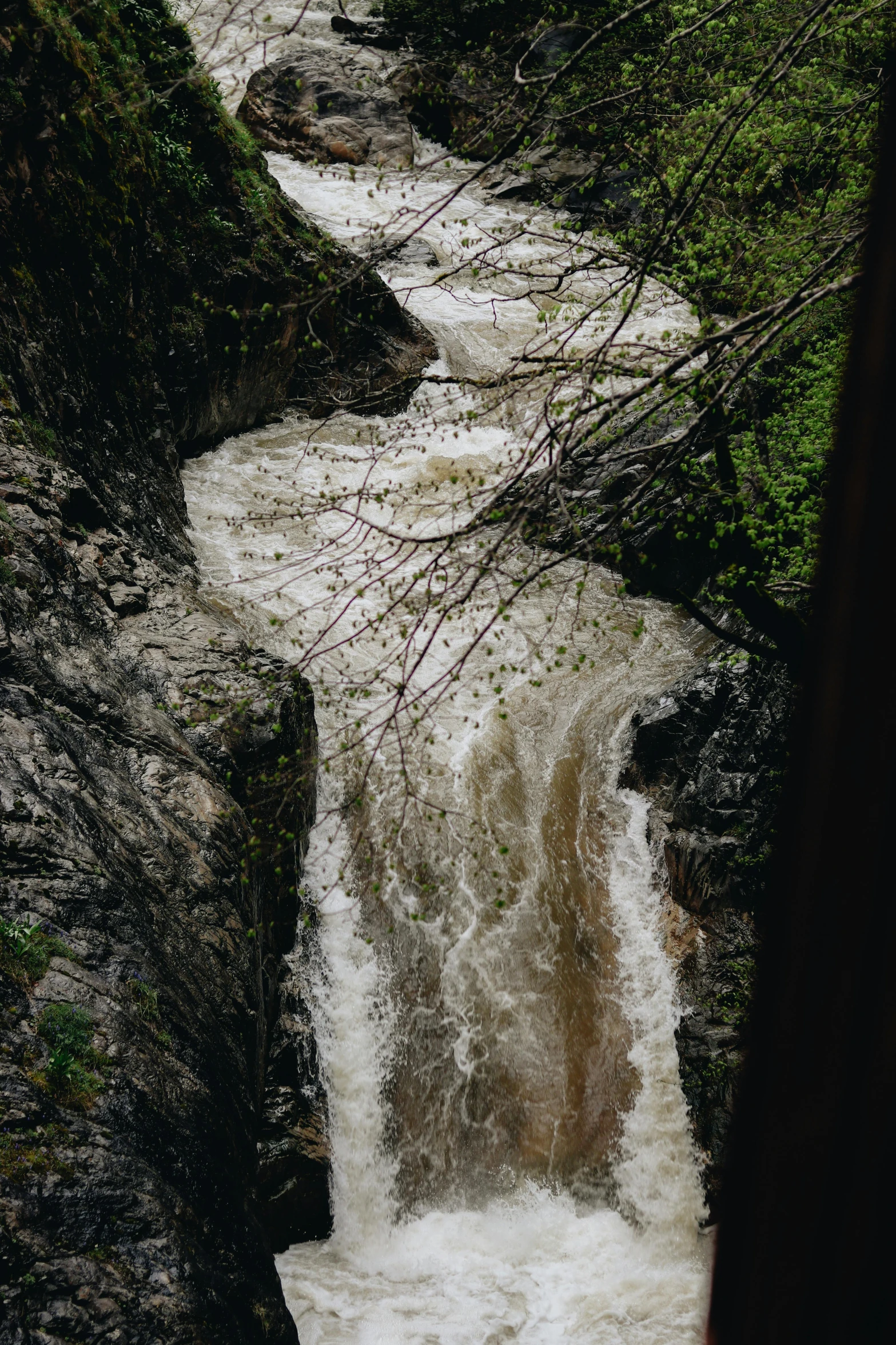 a stream of water flowing over some rocks