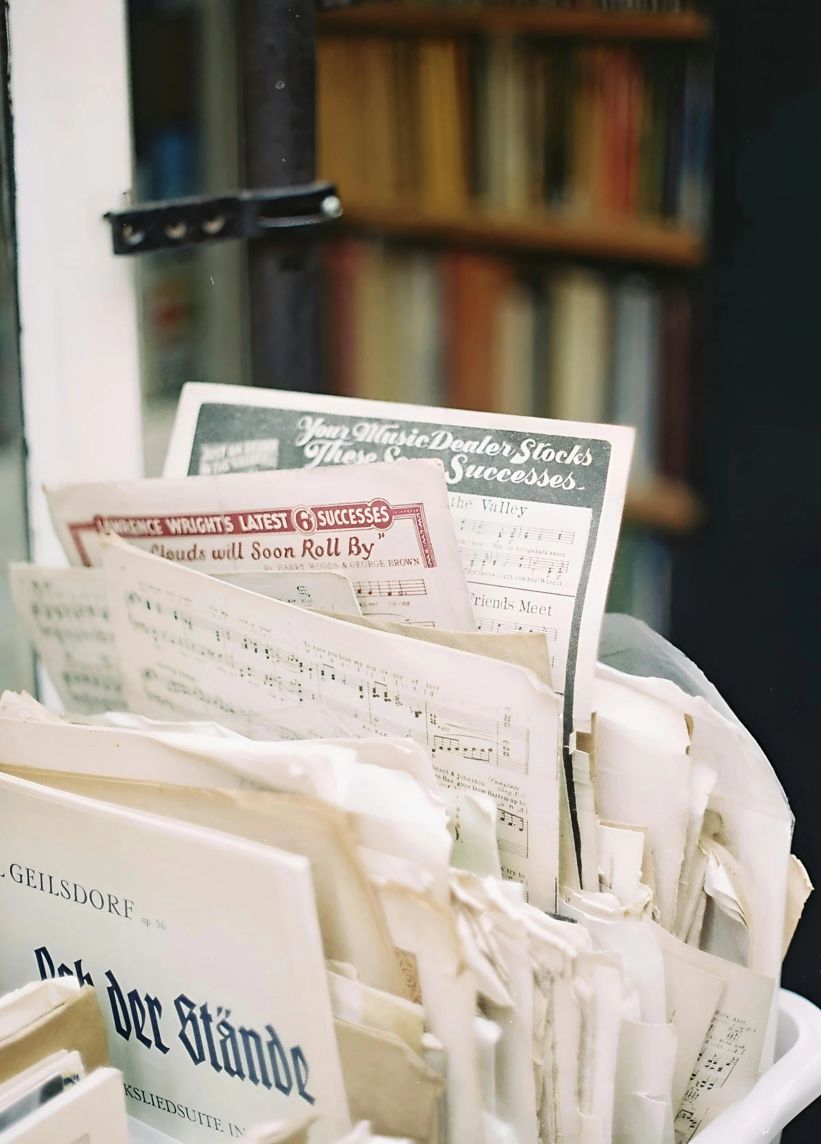 stacks of mail in a container outside