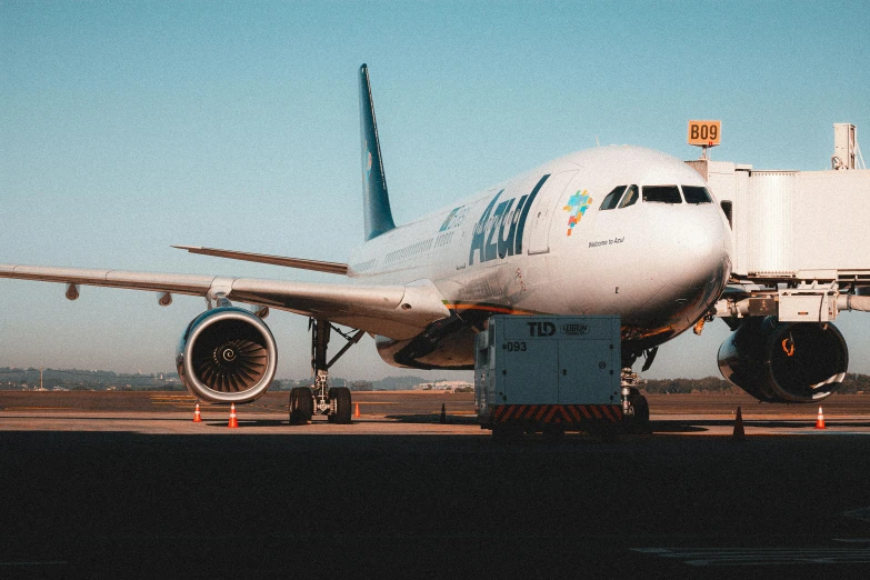 a large white plane is preparing to go out