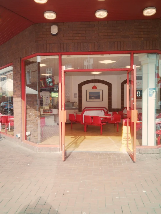 an interior po of a business building with red and white furniture