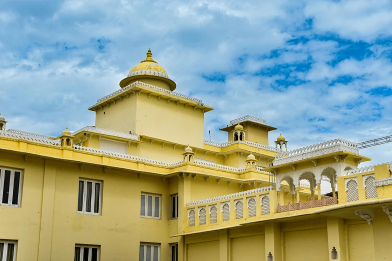 an image of a yellow building that looks like a temple