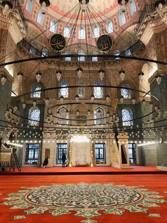 the inside of a large building with a very ornate ceiling