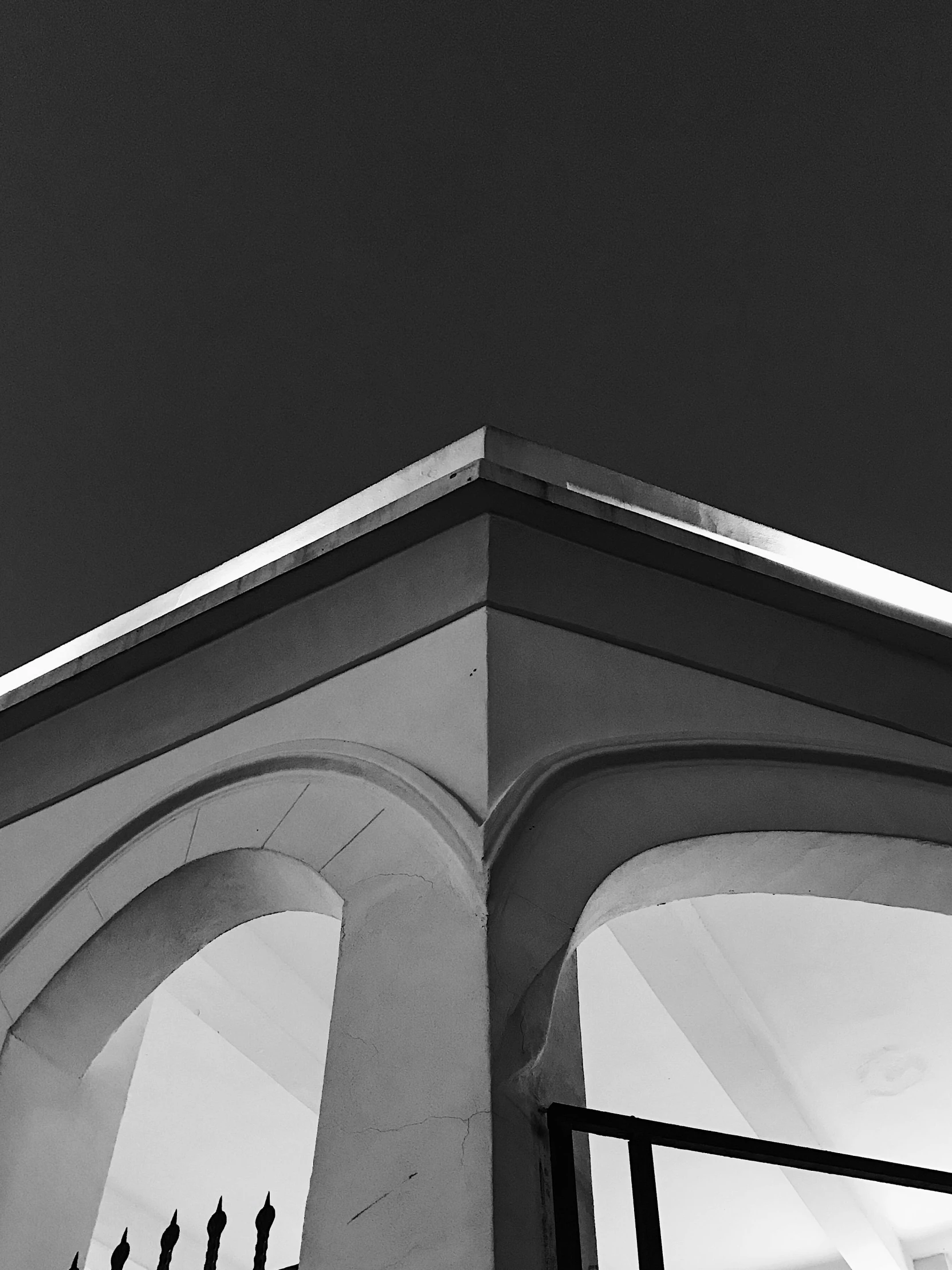 the roof and roof of an old building at night