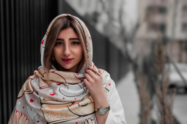 a woman in scarf with red hearts on it