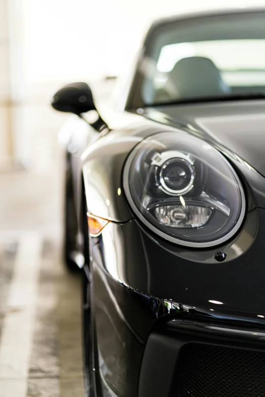 the front of a black sports car on display