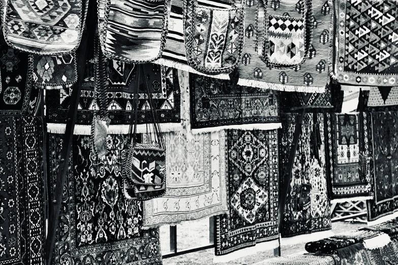 a group of rugs hanging together on a wall