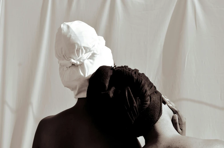 an image of a woman with a paper head covering