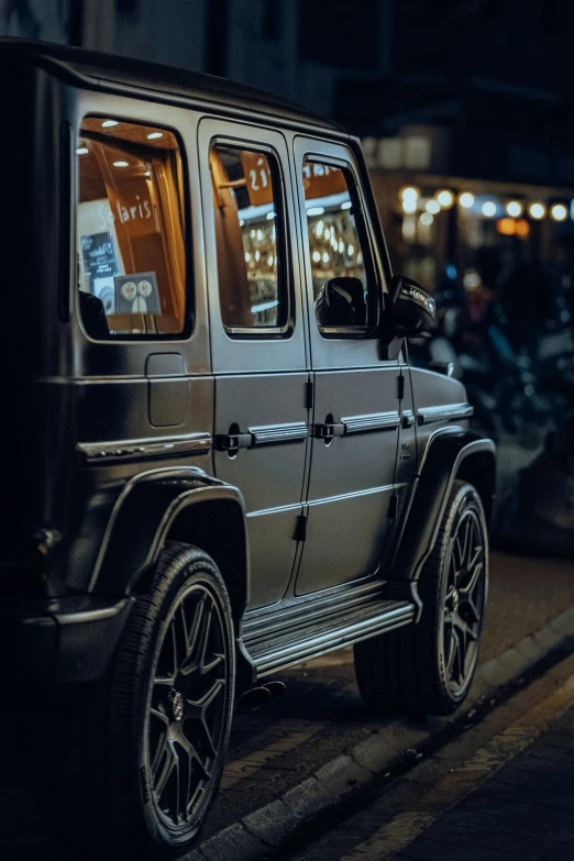 a car is parked on the street at night