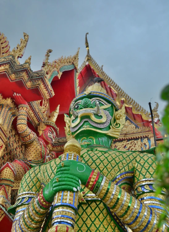 a colorful statue is in front of a building