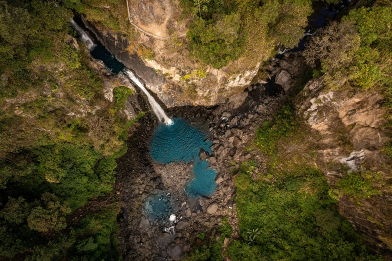 aerial view of waterfall from helicopter near trees