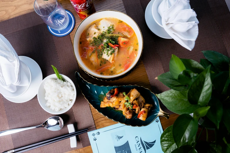 bowls of food are sitting on a mat