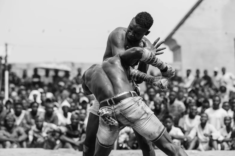 a man kicks another person on the head with his hands