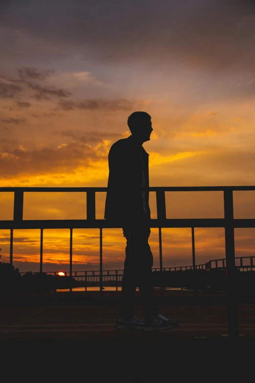 a man in silhouette looking into the distance