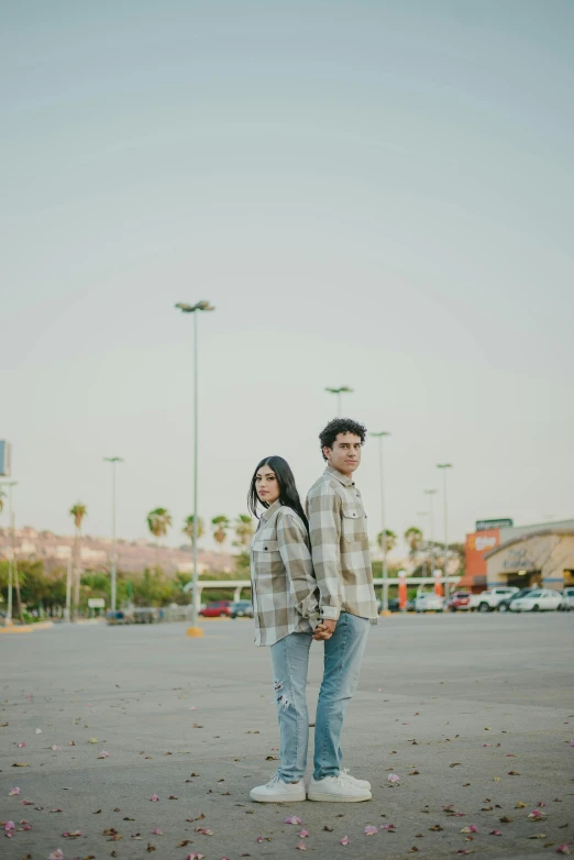 a man standing next to a woman holding hands