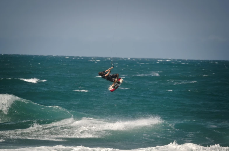 a surfer on a surf board is in the air