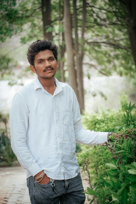 a man in the woods posing for a picture