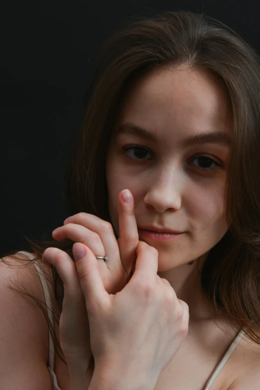 an attractive young woman posing with a knife