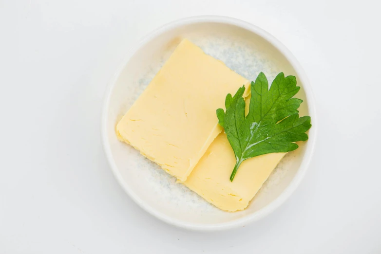 cheese in a bowl with parsley and parsley