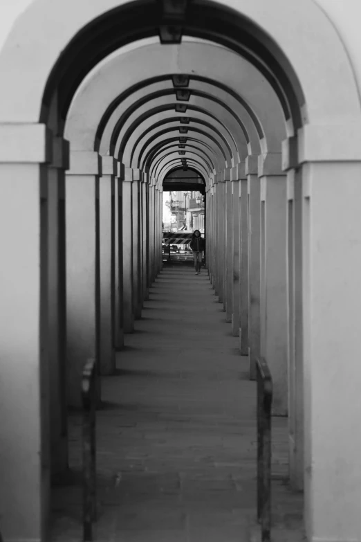 the black and white po shows arches that create a tunnel