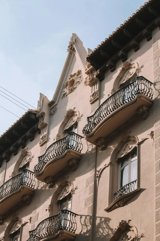 building with balconies and wrought iron balcony railing