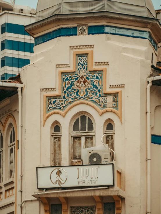 a large building with a clock in the front