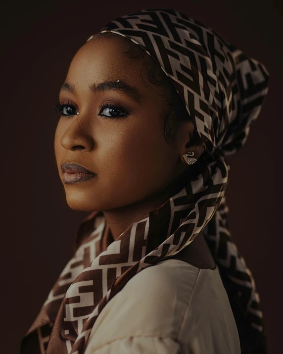 a black woman wearing an oriental headscarf