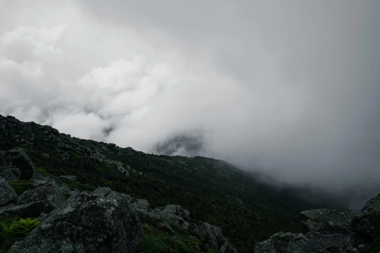 some very pretty mountain tops under a cloudy sky