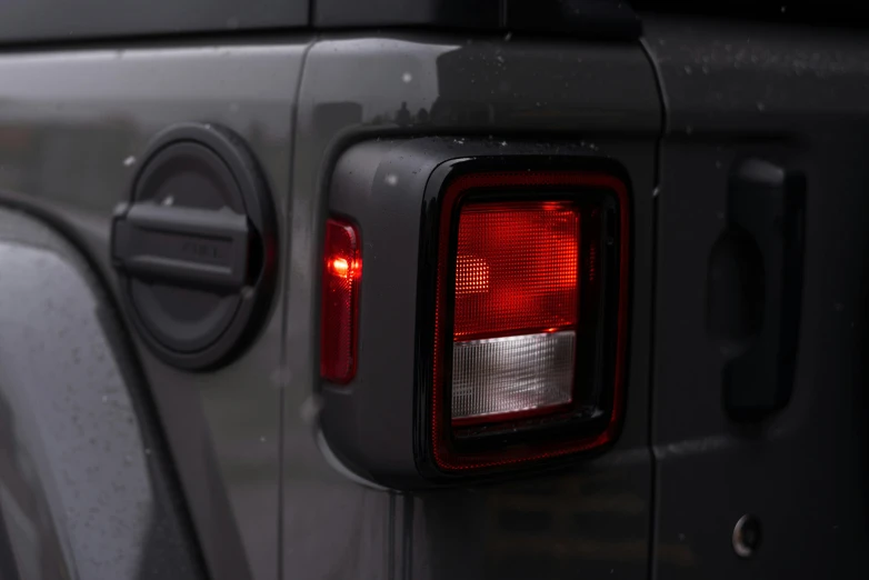 close up of a taillight on a black car