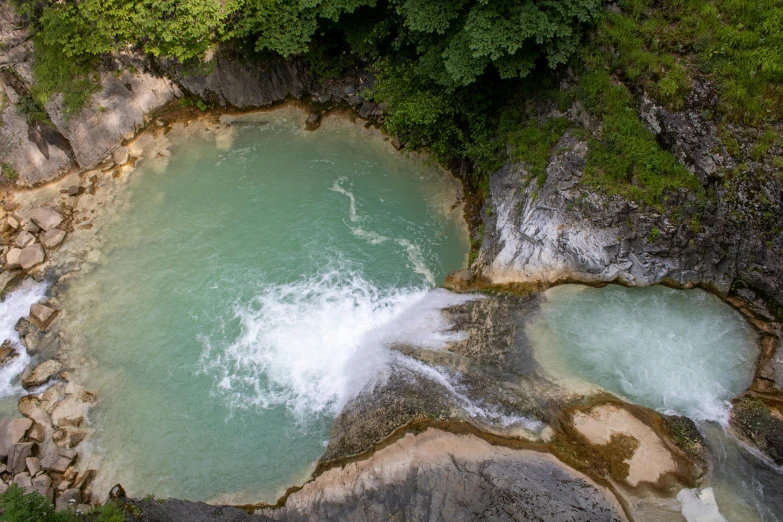 the river water is turquoise and turquoise with waves