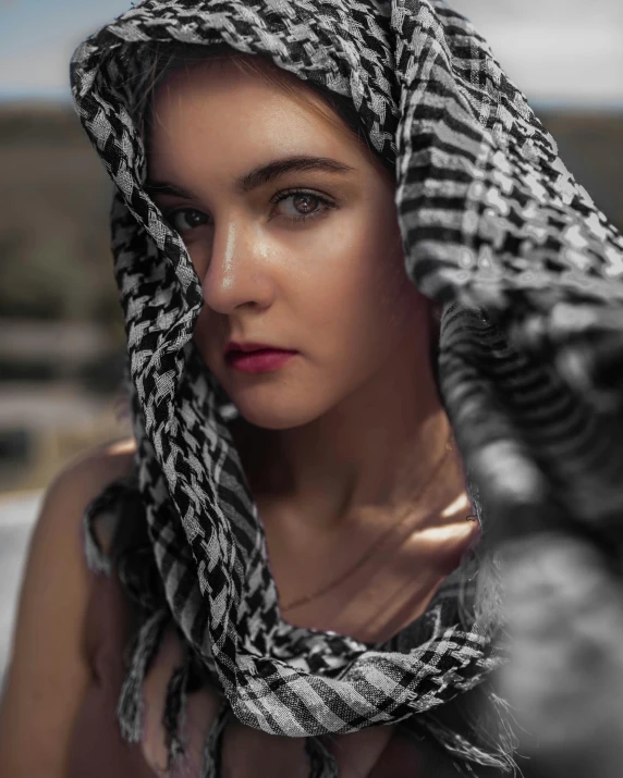 a woman wearing a scarf on top of her head