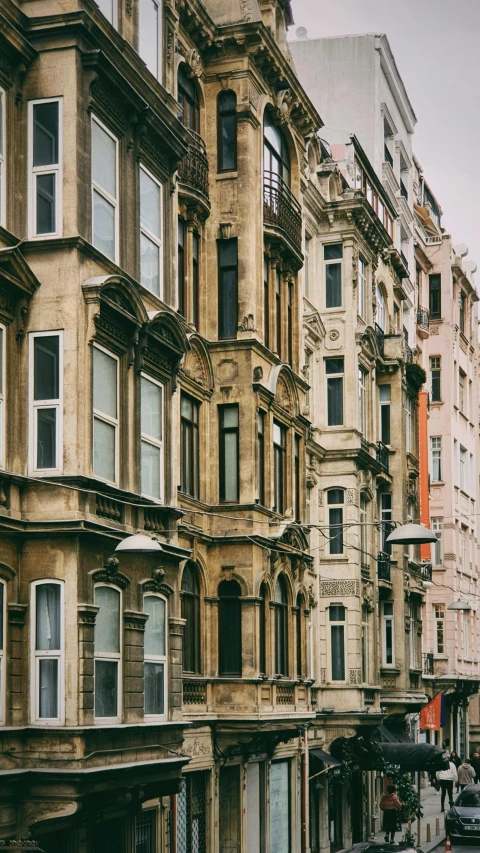 an old street in the midst of some tall buildings