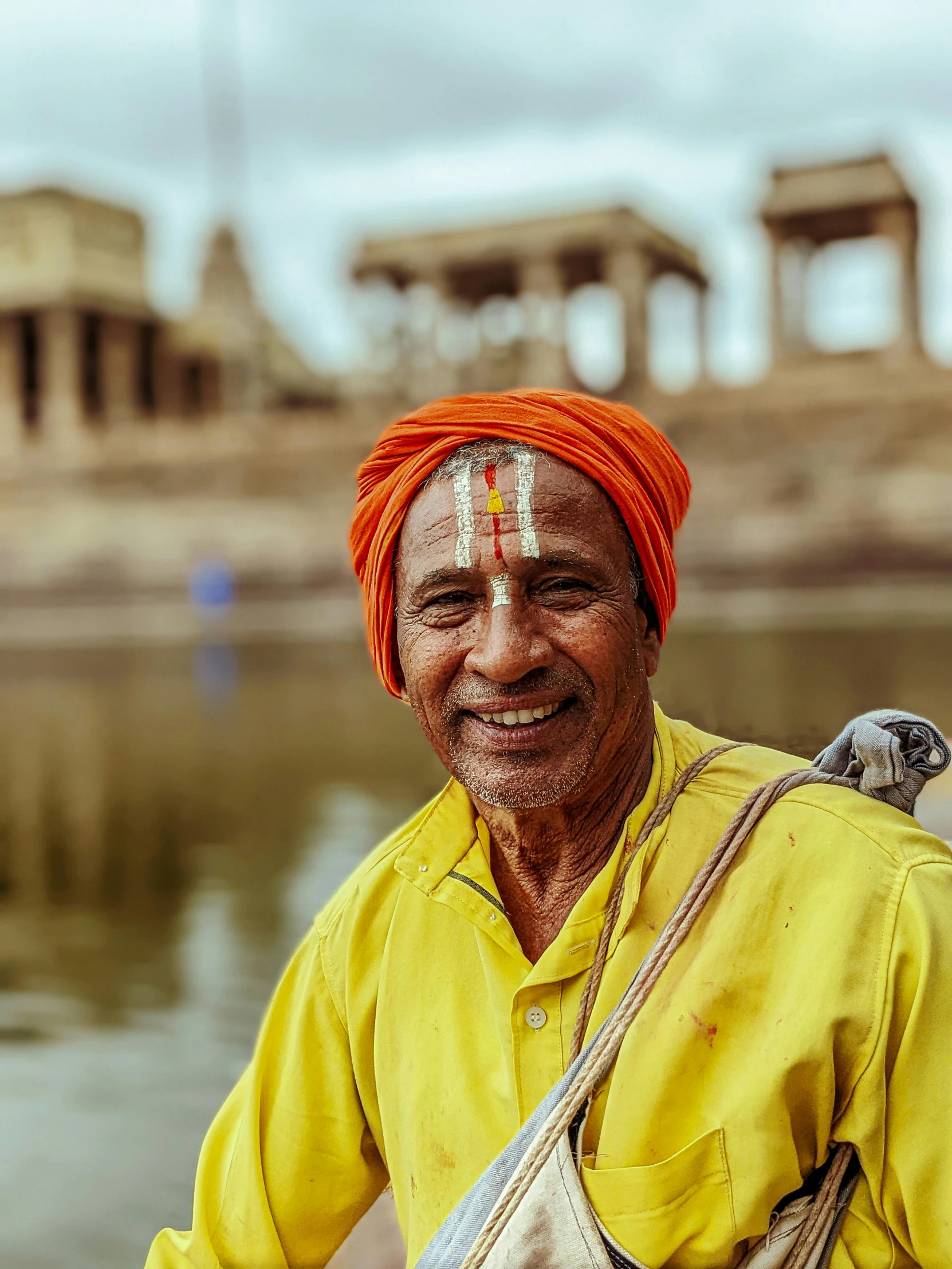 man with orange hair and a yellow shirt