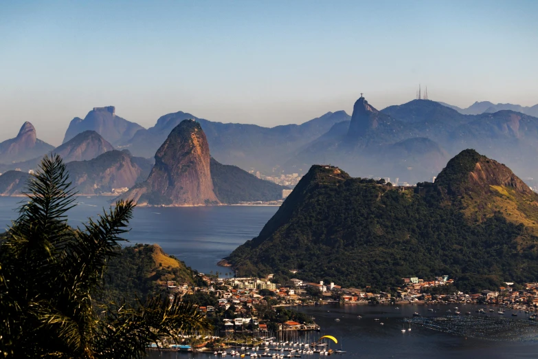 a very large island with mountains near a harbor