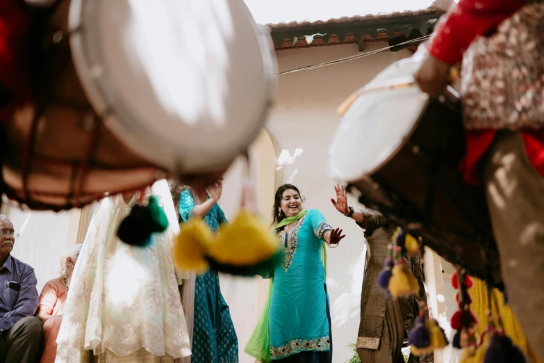 the woman is dancing with her hands in the air