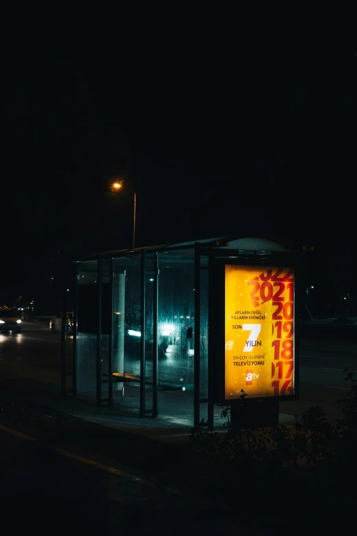 a bus stop that is in the middle of the night