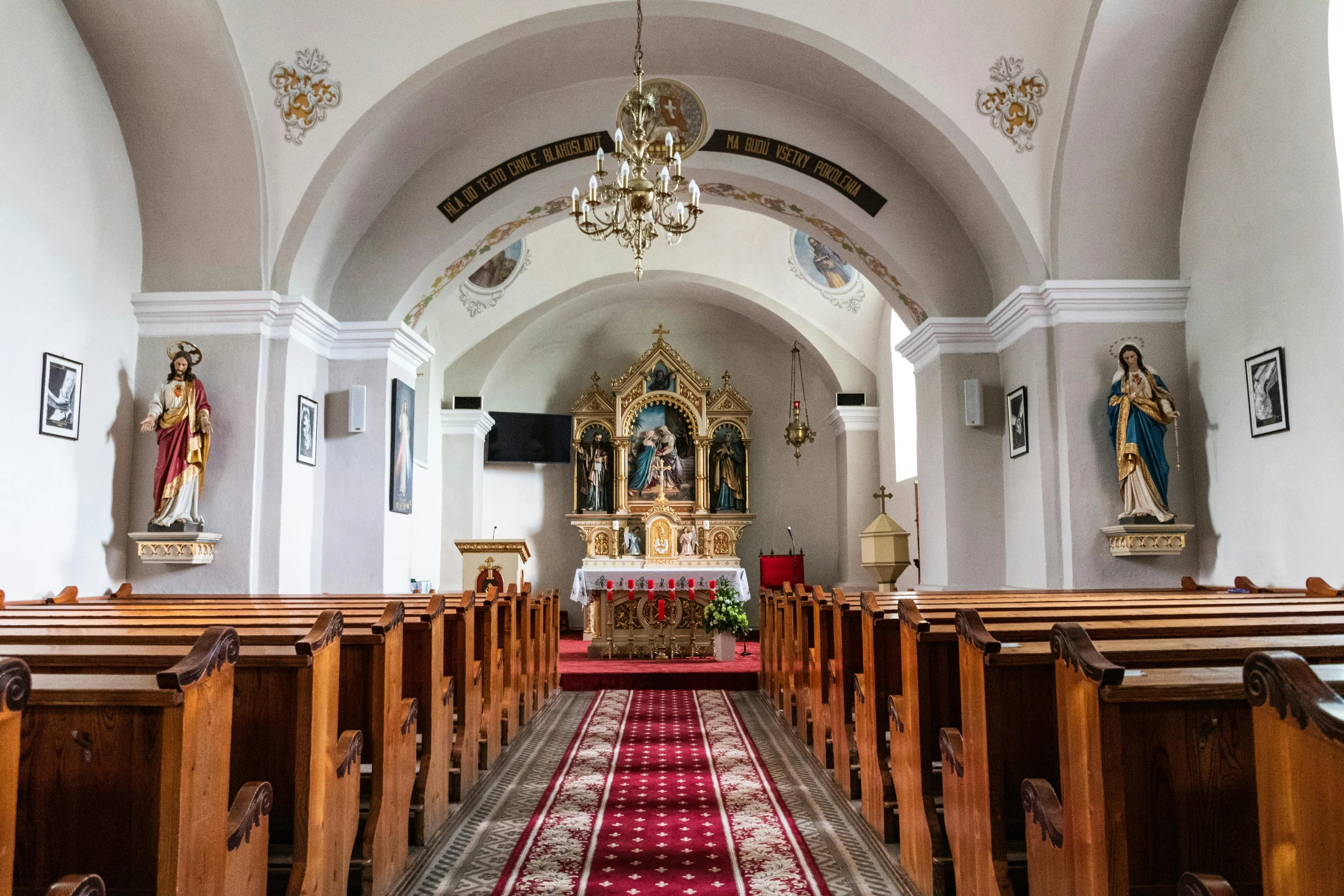 this church has wooden pews and an ornate ceiling