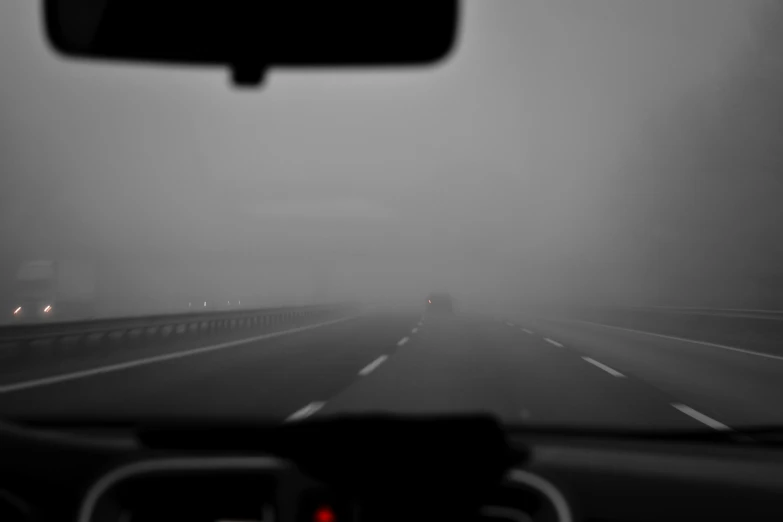 inside view from the driver's seat in a car on a highway