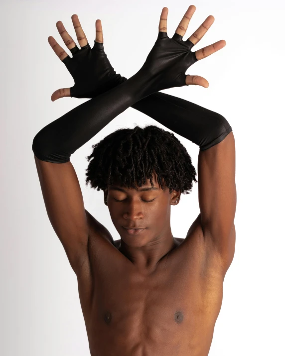 an african man is posing and holding his hand on his head