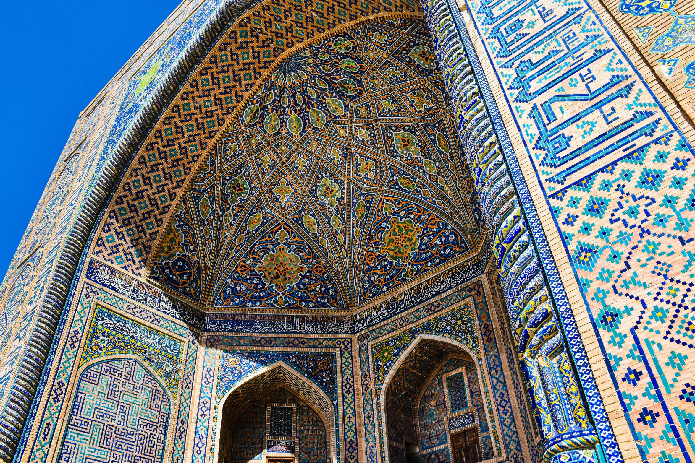 a tall building with a lot of colorful tiles